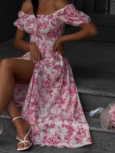 Detail of floral off-shoulder dress featuring bubble sleeves and a high side slit