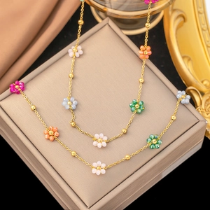 Colorful floral beaded necklace with gold metal chain and translucent flower charms