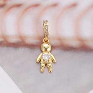 Detailed close-up of a gold-plated astronaut pendant with a heart-shaped zircon stone