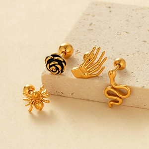 Vintage gold cartilage studs with rose, skull hand, snake and spider designs