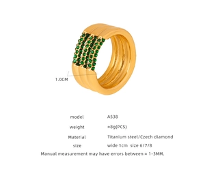 Detail of 1.0cm wide gold titanium steel ring with four rows of green Czech crystals