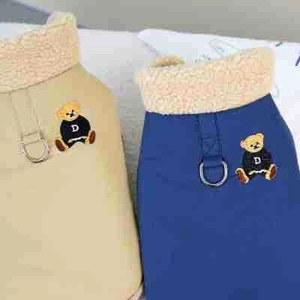 Close-up of pet puffer vests with warm fleece collars and bear embroidery for dogs