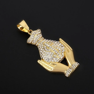 Close-up of hip hop money bag pendant with dollar sign and sparkling crystals in gold