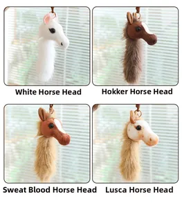 Detail view of four plush pony head keychains in white, brown, and spotted faux fur