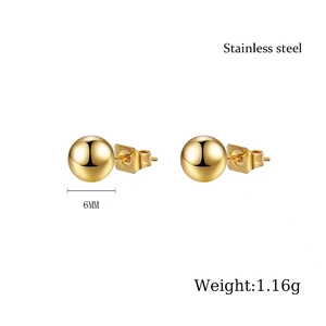 Detailed view of 6mm golden stainless steel ball stud earrings with polished finish