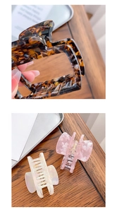 Detailed view of acetate hair claws featuring tortoiseshell patterns and bow shapes