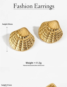 Detailed view of 30mm gold scallop earrings with radiated ridge texture and metallic finish