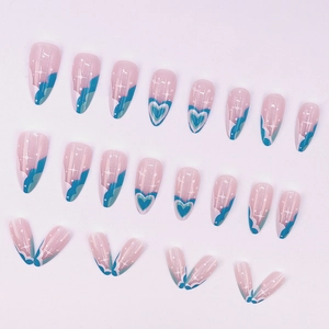 Blue and pink almond press-on nails with heart patterns and starry glitter accents