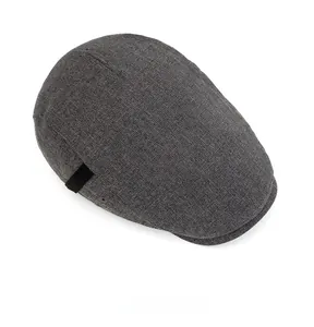 Top view of dark grey vintage flat cap showing premium woven fabric and side strap detail