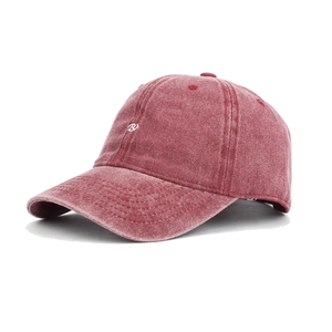 Close-up of R letter embroidery on washed burgundy baseball cap with white logo
