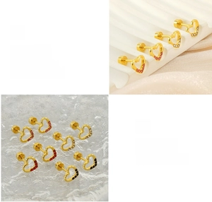 Detail of gold heart earrings with colored stones and secure threaded screw backs