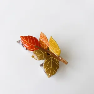 Autumn maple leaf hair claw clip with colorful acrylic foliage and squirrel design