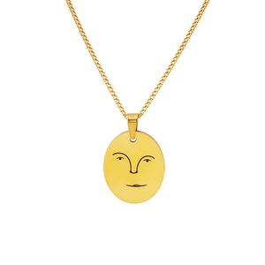 Collier doré minimaliste avec pendentif ovale et motif abstrait de visage ajouré