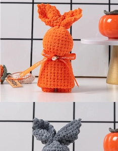 Detail of coral fleece towels folded into rabbit shapes with ribbons and pearls