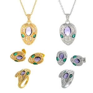 Parure serpent en or et argent avec gemmes violettes et cristaux pavés étincelants