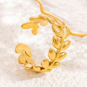Minimalist golden stainless steel open ring with hollow leaf design for women