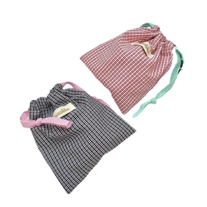 Portable cotton drawstring organizer pouch with classic red and black plaid patterns