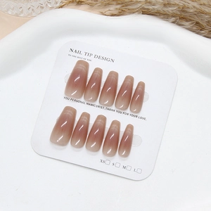 Pink cat eye gradient coffin press-on nails set on minimalist white display tray
