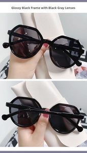Close-up of hexagonal black frame sunglasses KD98052 with dark grey resin lenses