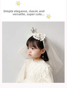 Close-up of girls crown headband with lace bow and multilayered tulle bridal veil