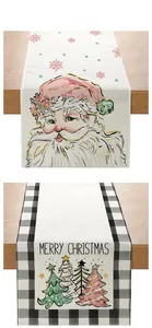Detail of Christmas table runners with Merry Christmas text and festive tree illustrations