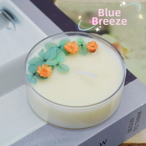 Detailed close-up of handmade aromatherapy candle with dried flowers in glass jar