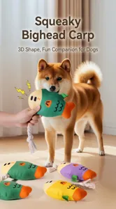Dog playing with squeaky plush fish toy featuring a durable cotton rope for tugging