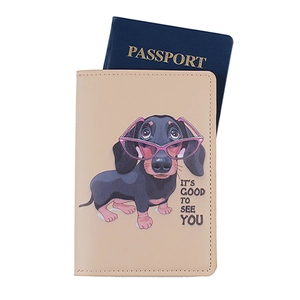 Detail of beige faux leather passport holder with cartoon dachshund and passport slot