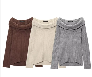 Detail view of off-shoulder knitted sweaters in brown, white, and grey with ribbed texture