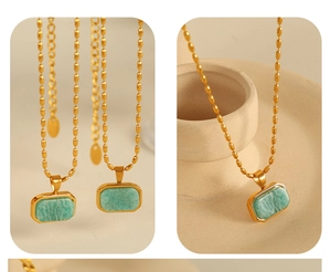 Detail of gold beaded chain with a rectangular green amazonite stone pendant necklace