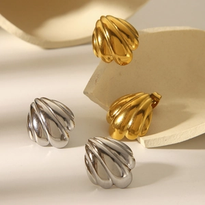 Polished 18k gold and silver stainless steel shell earrings set on decorative stone