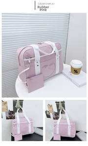 Macro view of dusty pink JK uniform bag featuring a heart-shaped transparent window