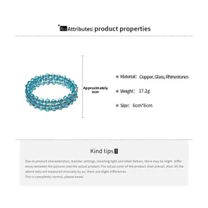 Detailed view of triple-layer blue glass bead bracelet with rhinestone accents