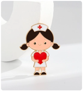 Detail of cartoon nurse enamel pin with red heart and gold-plated edges on white decor