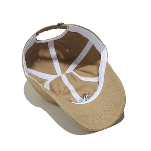 Detailed interior of khaki cotton baseball cap showing sweatband and adjustable buckle