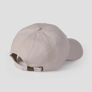 Detail view of cotton baseball cap showing back metal buckle and ventilation eyelets