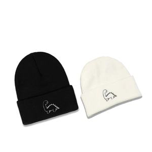Knitted dinosaur beanies in black and white colors for autumn winter warmth