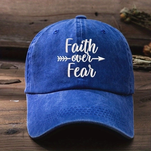 Macro detail of Faith over Fear embroidery on a navy washed cotton baseball cap