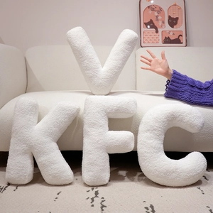 Soft white alphabet throw pillows in plush fleece texture for home sofa decoration