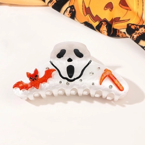Detail of Halloween ghost claw clip featuring Ghostface, bats, and rhinestone accents