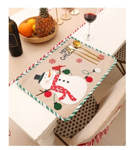Detailed top view of a rustic Christmas snowman placemat on a festive holiday table
