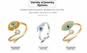 Detail shot of three evil eye rings with gold and silver plating and zircon stones