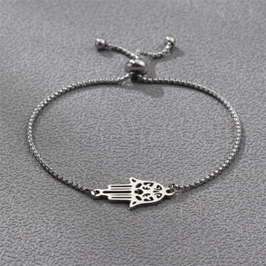 Detailed macro view of adjustable silver Hamsa Hand charm bracelet with sliding clasp