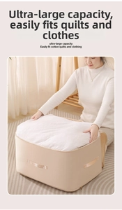 Detail showing high-capacity beige satin storage bag fitting a large white comforter