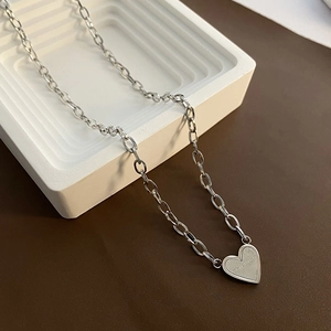 Silver heart pendant necklace with Never Forget engraving and thick O-chain design