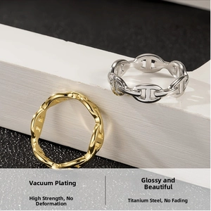 Detailed view of titanium steel pig nose rings in vacuum plated gold and silver finish