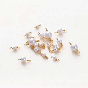 Detail of 18K gold-plated pearl connectors for DIY jewelry making and handmade crafts