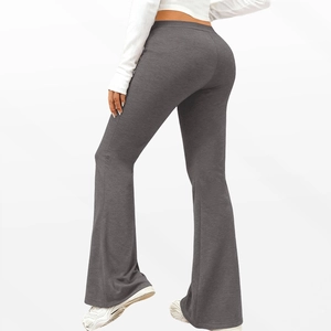 Detail of high waisted maternity yoga flare pants in dark grey with wide leg cut