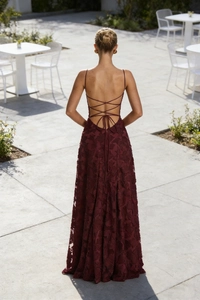 Detailed back view of burgundy lace dress featuring elegant criss-cross tie straps