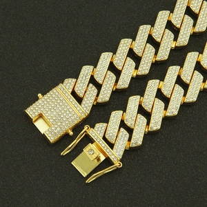 Iced out gold Cuban link chain for men featuring sparkling pavé crystals and box clasp